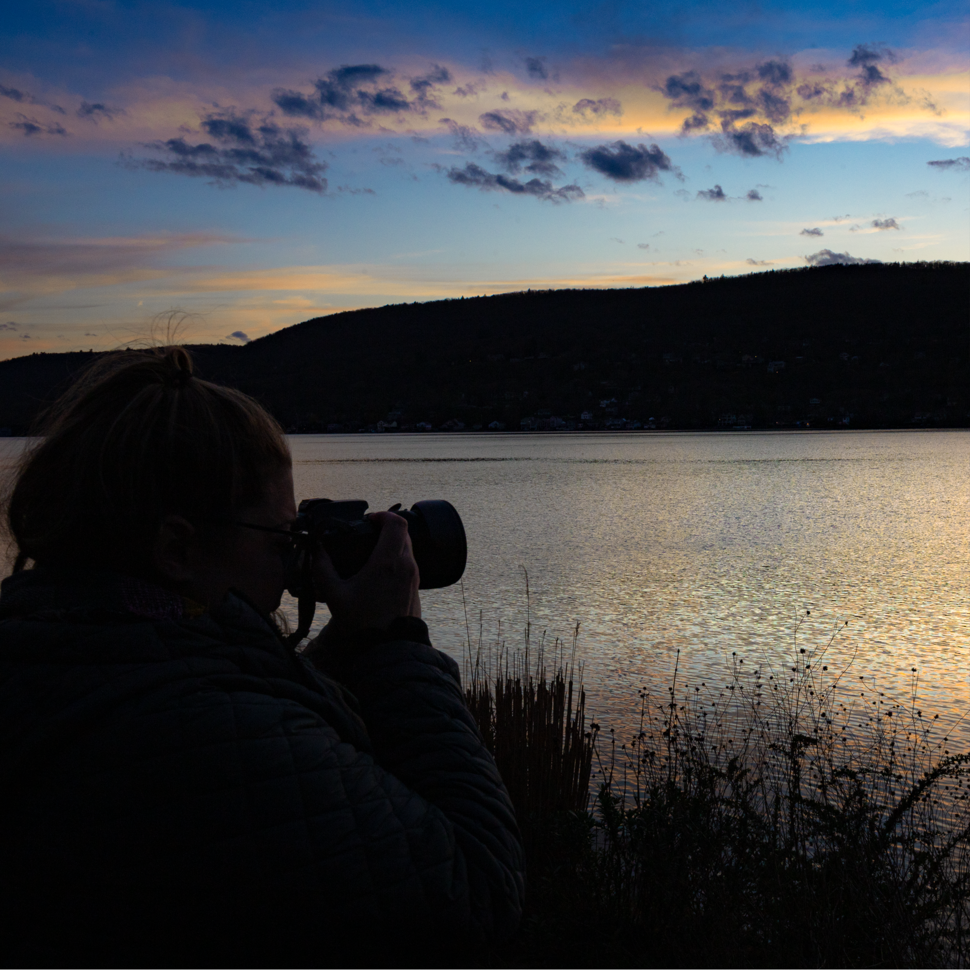She's snapping a  magical sunset at the lake  2
