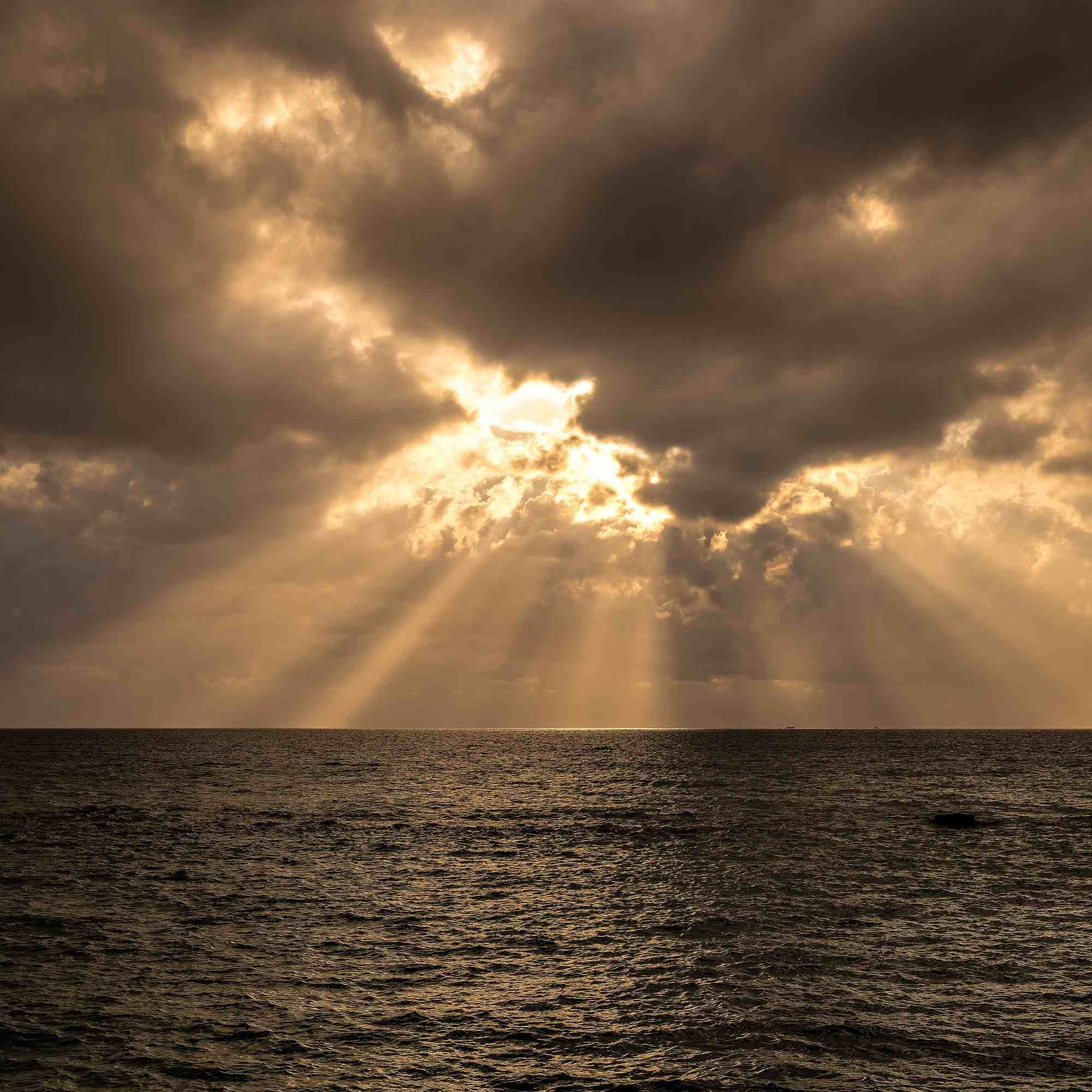 Golden Rays Breaking Through Clouds Over the Cilento Coast – A Fine Art Photograph