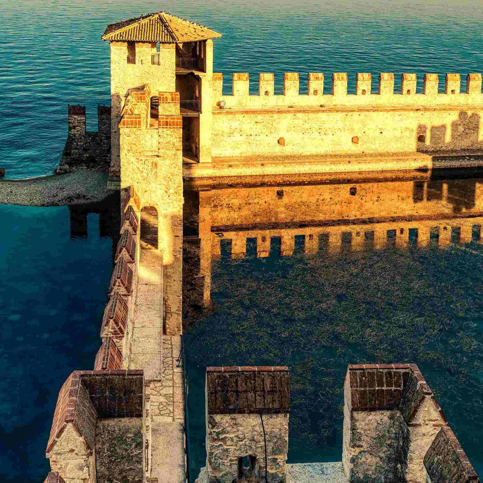 Reflection of the Scaligero Castle Walls on Lake Garda – A Fine Art Photograph