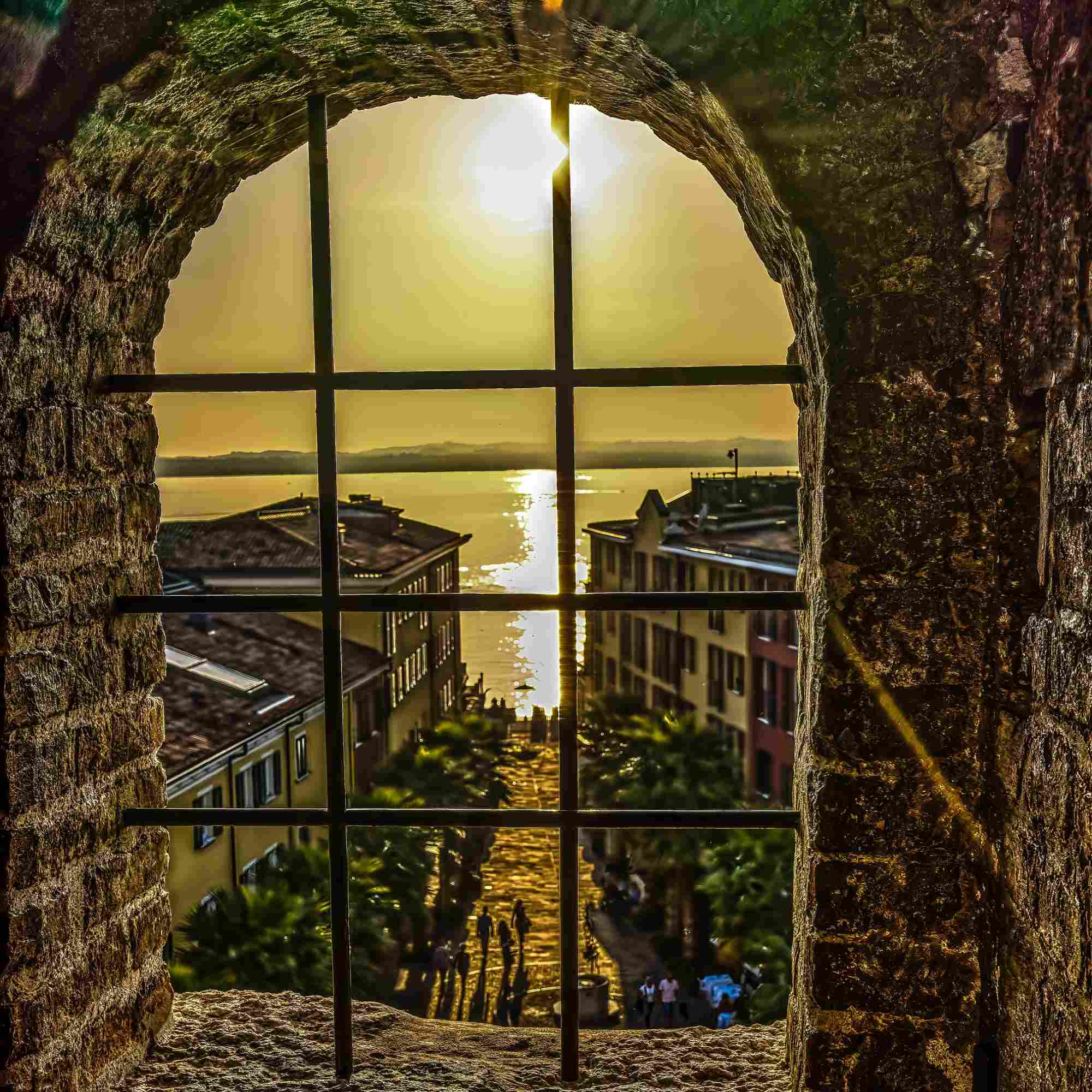 Framed Sunset Through the Castle Window in Sirmione – A Fine Art Photograph